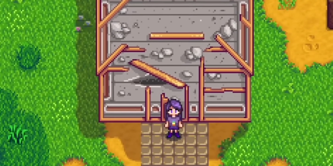 Old ruined greenhouse building on the farm before restoration in Stardew Valley